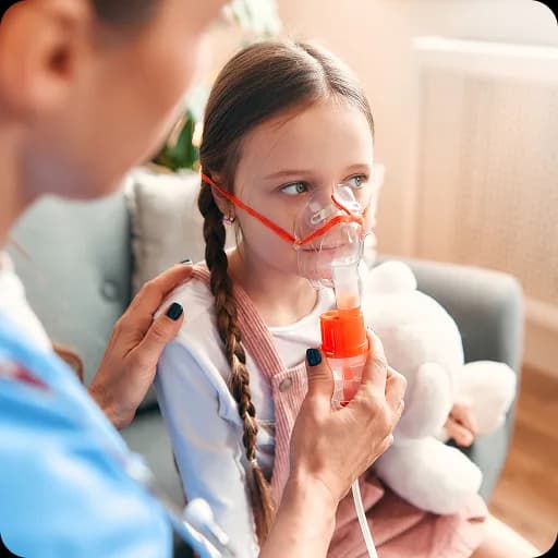 Girl using an asthma inhaler
