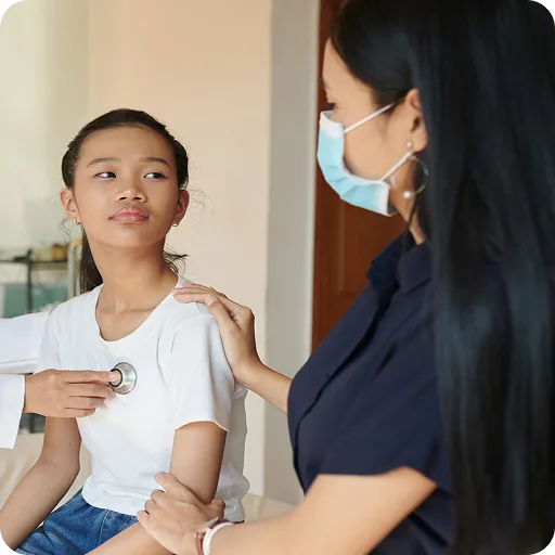 Teenage girl being examined by a doctor