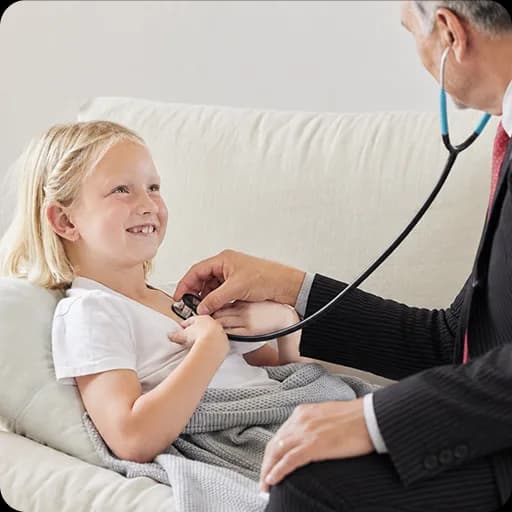 Doctor listening to a girl's chest with a stethoscope