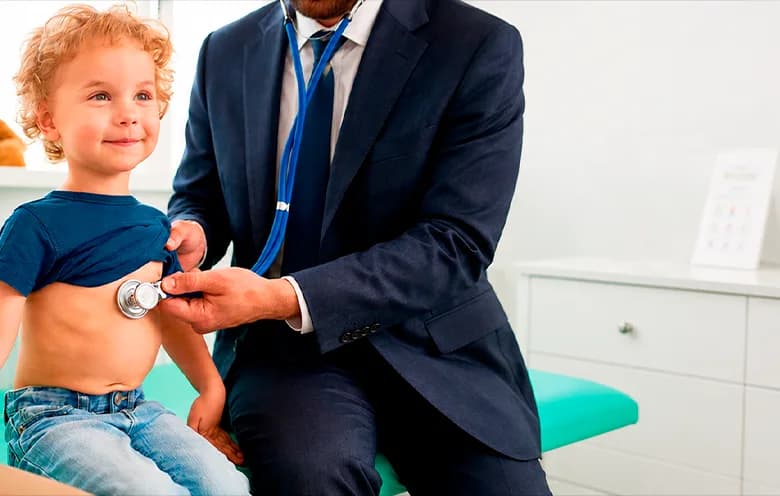 Paediatrician examining a toddler