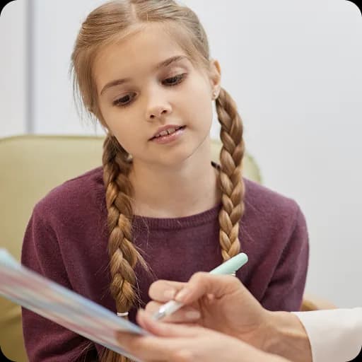 Girl writing with a doctor