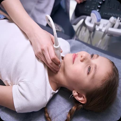 Teenage girl lying down holding her tummy