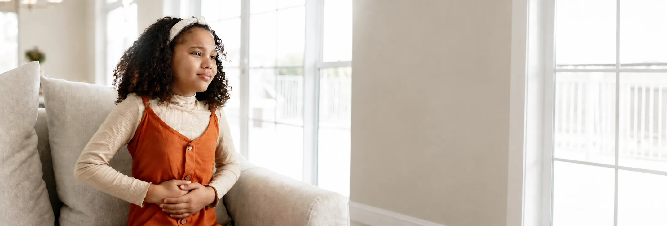 Teenage girl sitting on a sofa