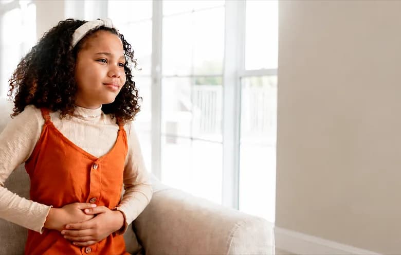 Teenage girl sitting on a sofa