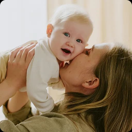 Mother cuddling a baby