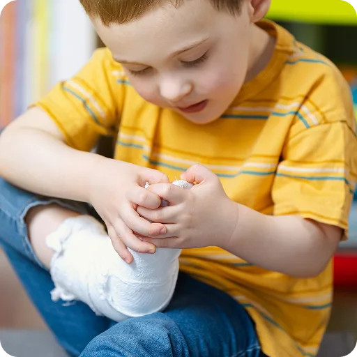 Boy holding his ankle