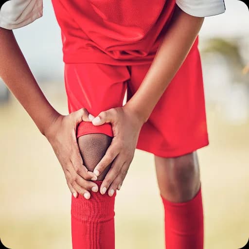 Child holding a sore knee