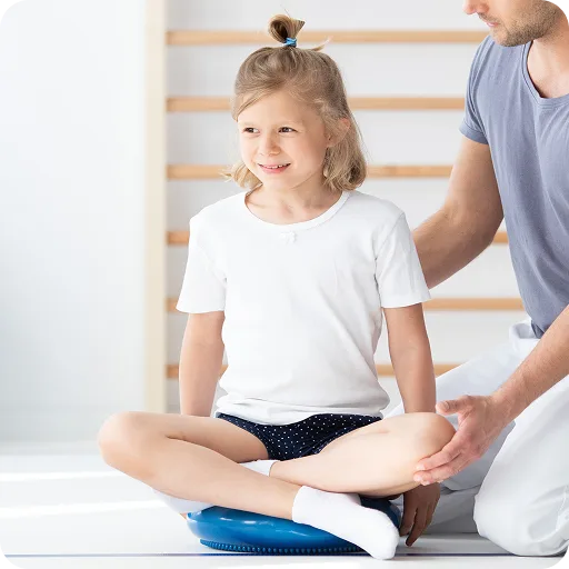 Girl sitting with a physiotherapist