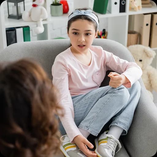 Girl sitting in an armchair