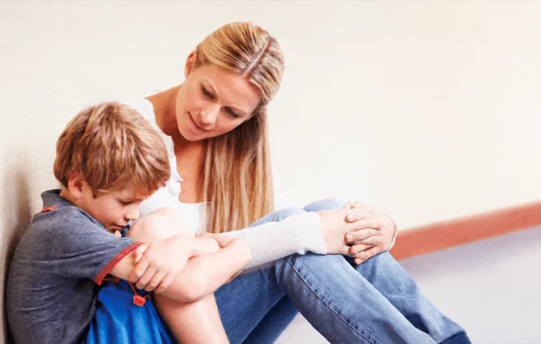 Mother and child sitting on stairs