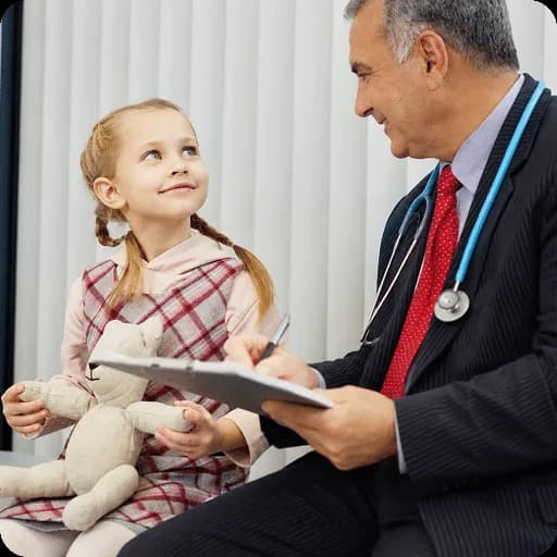Paediatrician talking with a young girl