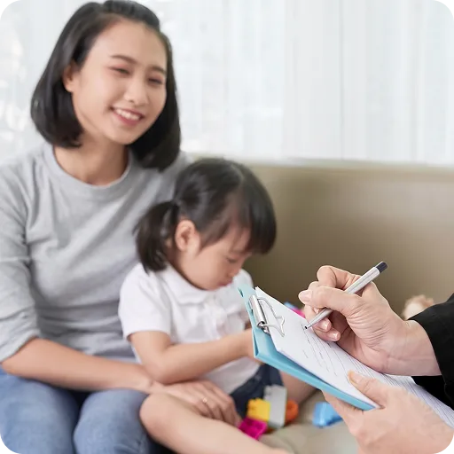 Paediatrician taking notes during a home visit