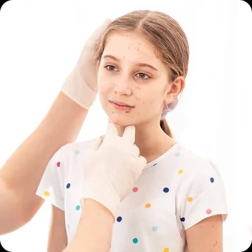 Girl applying cream to her face
