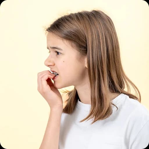 Girl biting her nails anxiously