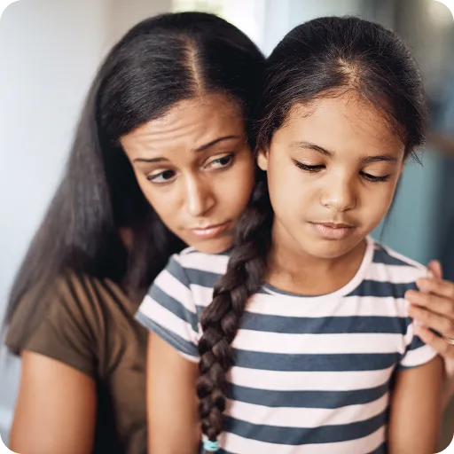 Two young sisters looking worried
