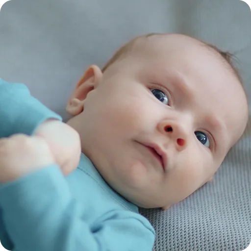 Baby lying on its back looking up