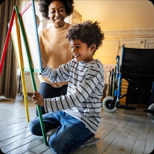 Boy playing on a floor with toys