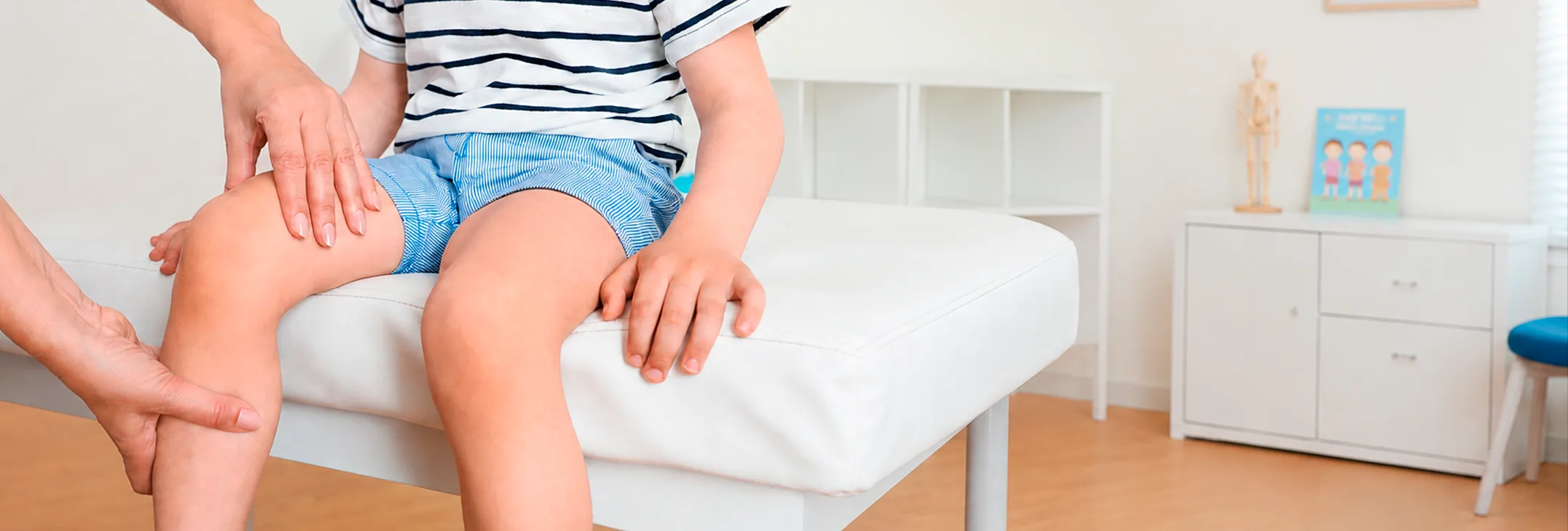 Child's legs being examined on a couch