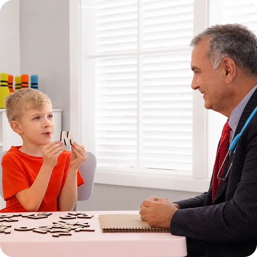 Paediatrician talking with a young boy