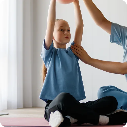 Child doing exercises with a therapist