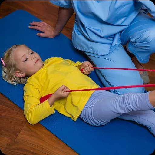 Child doing exercises with a therapist