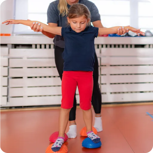 Child walking with support between bars