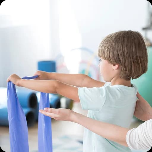 Therapist helping a child with an exercise