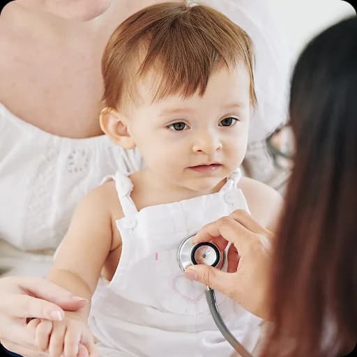 Baby looking up at an adult