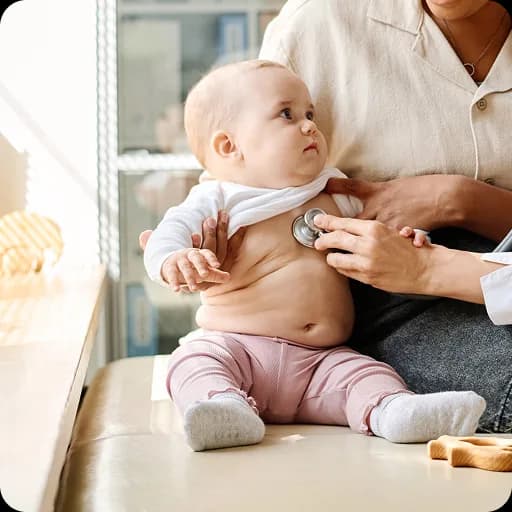 Doctor examining a baby