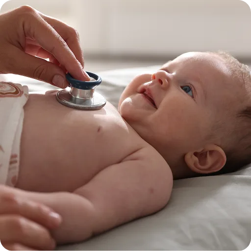 Doctor listening to a baby's chest with a stethoscope