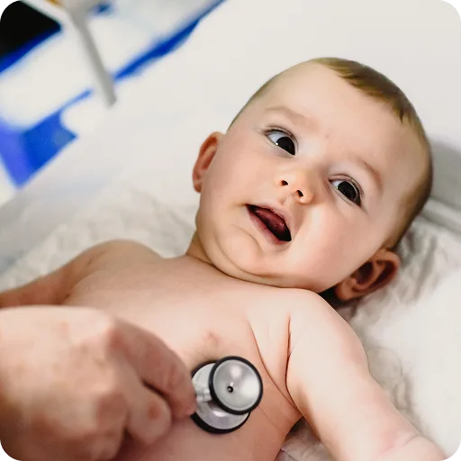 Doctor listening to a baby's chest with a stethoscope