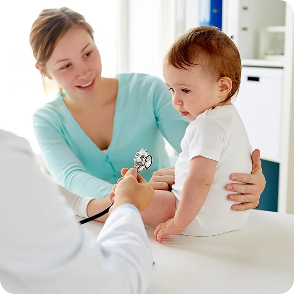 Nurse examining a toddler