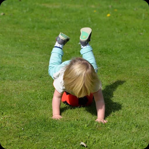Toddler crawling on grass