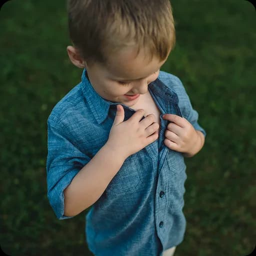 Boy holding his chest