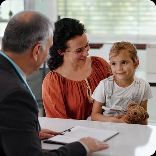 Paediatrician talking with a mother and child