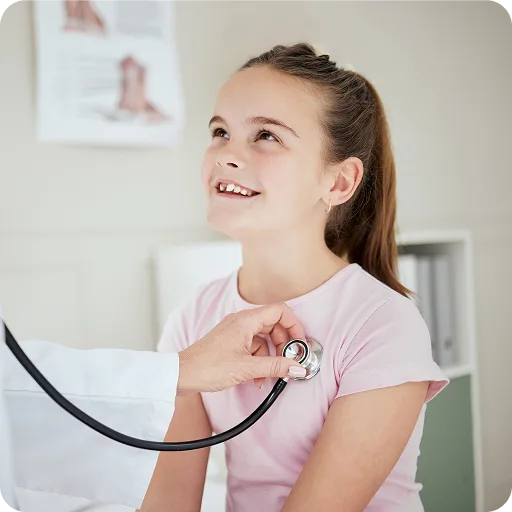 Teenage girl having her chest listened to