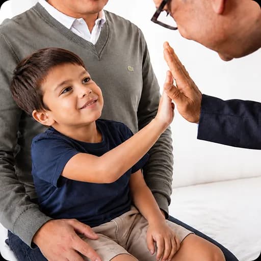 Paediatrician examining a young boy at the clinic