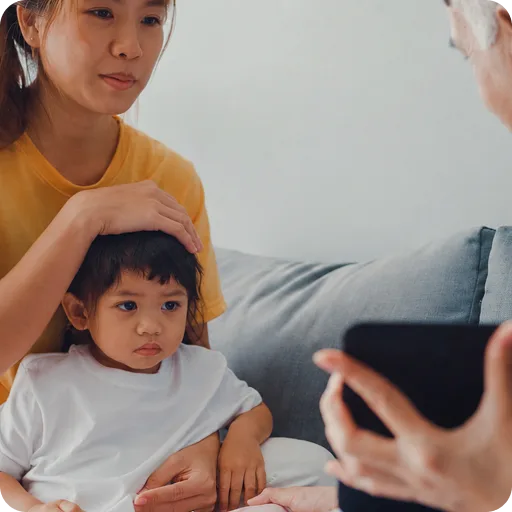 Mother and child having a blood pressure check