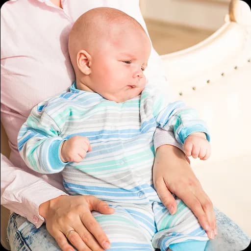 Baby lying on its back being examined