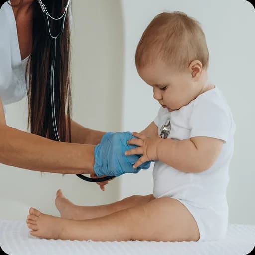 Baby sitting up during an examination