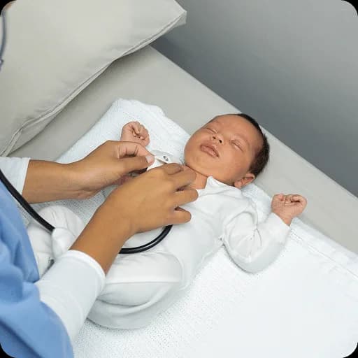 Doctor examining a newborn baby