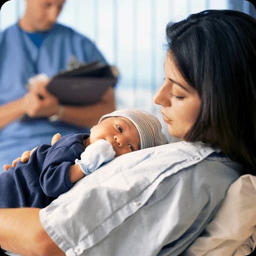 Mother holding a baby during a consultation