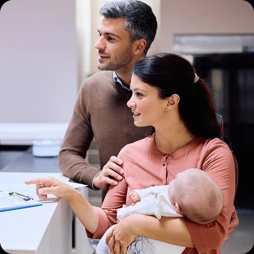 Parents holding a newborn baby