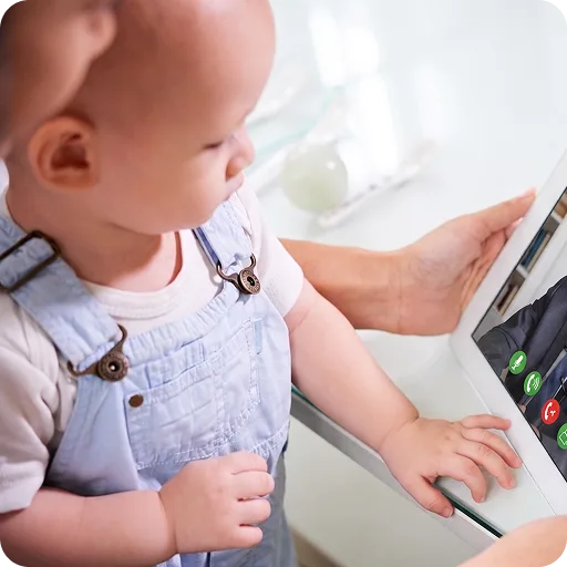 Baby looking at a laptop