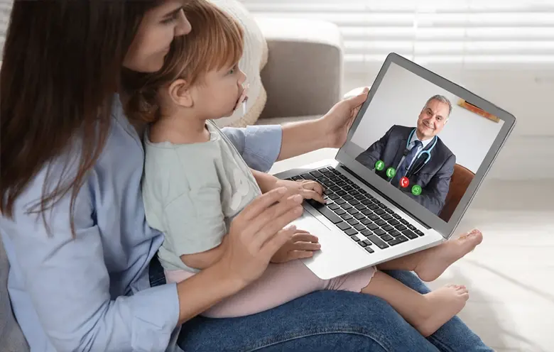 Mother and child on a video consultation with a doctor