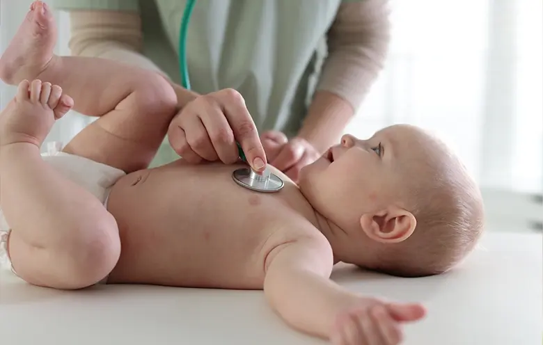 Doctor examining a baby