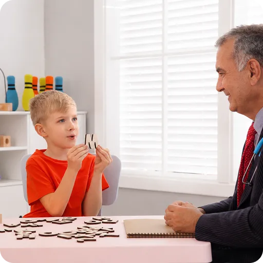 Paediatrician with a girl at a table